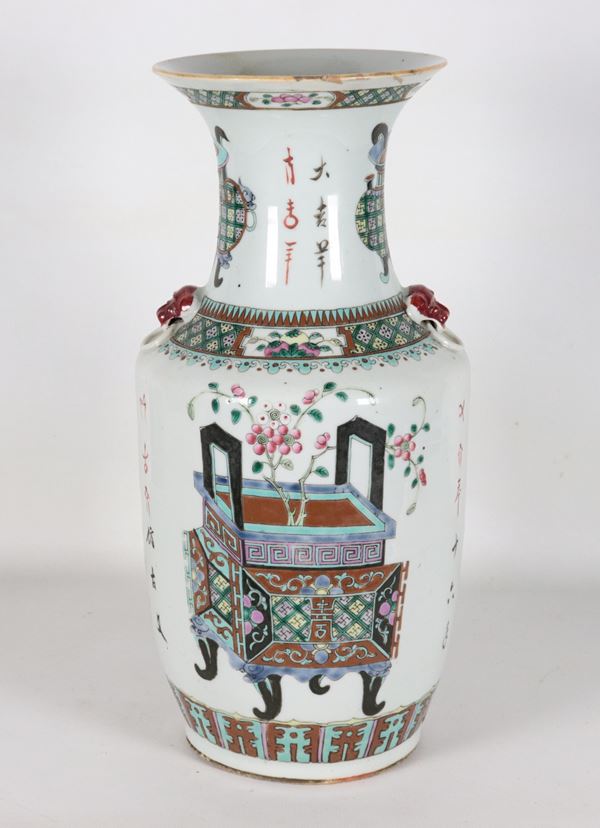 Antique Chinese porcelain vase with polychrome enamel decorations featuring flower baskets, incense burners and inscriptions, handles in the shape of lions' heads