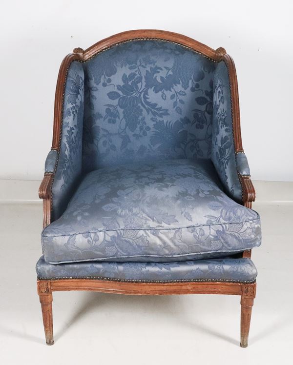 Antique French bergère armchair in Louis XVI style in light mahogany