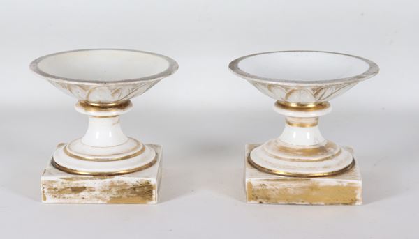 Pair of small antique French white porcelain cake stands, Old Paris style, with pure gold decorations and Empire motifs.