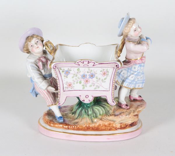 Small polychrome German porcelain flowerpot with figurines of children