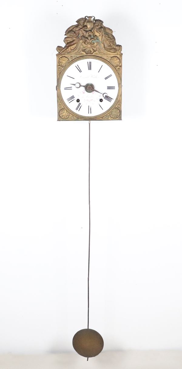 Antique Comtoise pendulum clock in repoussé copper with white enamel dial signed