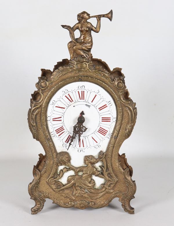 Antique French Louis XV style table clock, in bronzed and gilded metal, with a figurine of a "Woman with a Trumpet", dial with Roman numerals