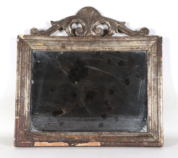 Antique Roman Louis XV altarpiece, in silvered mecca wood with a carved cymatium with acanthus leaf and shell motifs, mercury mirror