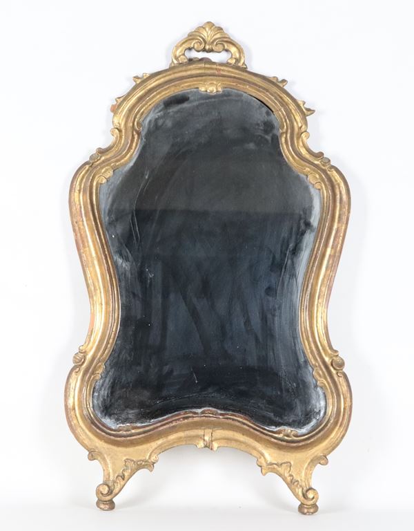 Antique small Venetian mirror with a shaped line in gilded and carved wood, mercury mirror