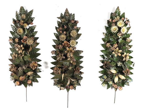 Lot of three lacquered and painted copper decorations with palm and flower motifs