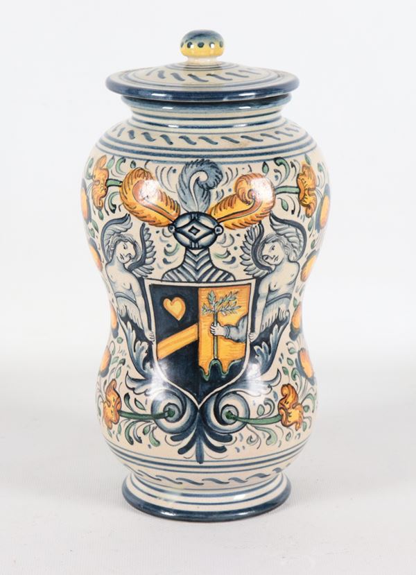 Albarello in polychrome glazed majolica from Deruta with family crest and angels