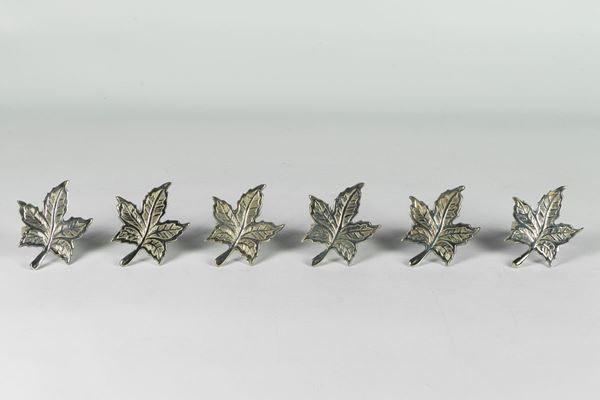 Six napkin holders in the shape of a vine leaf