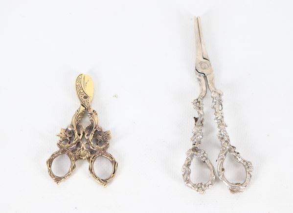Lot of two antique grape shears, one silver and one gold-plated. Net silver weight: 63 grams.
