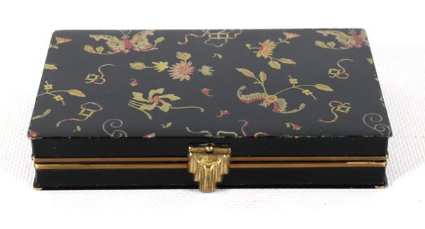 Liberty-style black Bakelite makeup bag with polychrome flower and butterfly motifs.