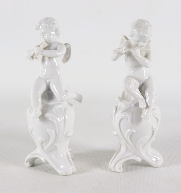 "Putti Players", a pair of white Capodimonte porcelain figurines