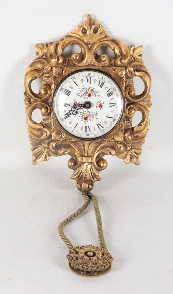 Wall clock in gilded bronze, embossed and chiseled with Louis XV motifs, white enamel dial with floral decorations