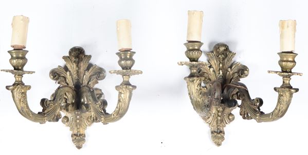 Pair of antique gilded bronze wall lamps, embossed and chiseled, with cornucopia arms