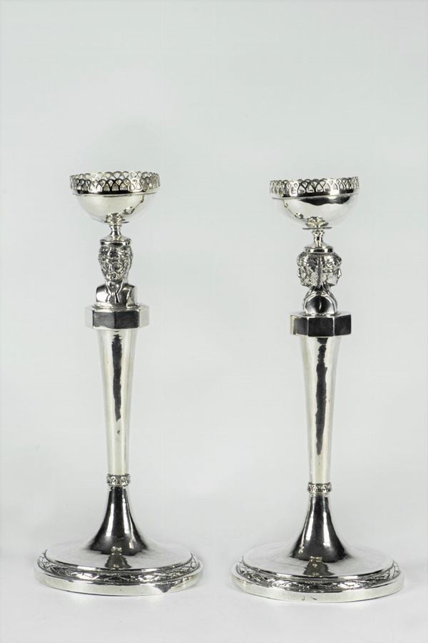 Pair of Roman candlesticks in silver