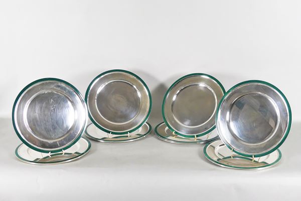 Twelve silver placemats with green enamel edges. 6680g