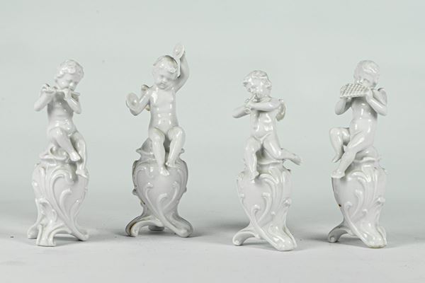 Four figurines &quot;Puttini players&quot;
