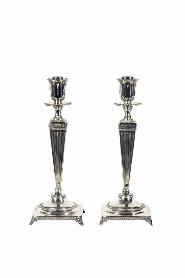 Pair of silver candlesticks. About 500 grams
