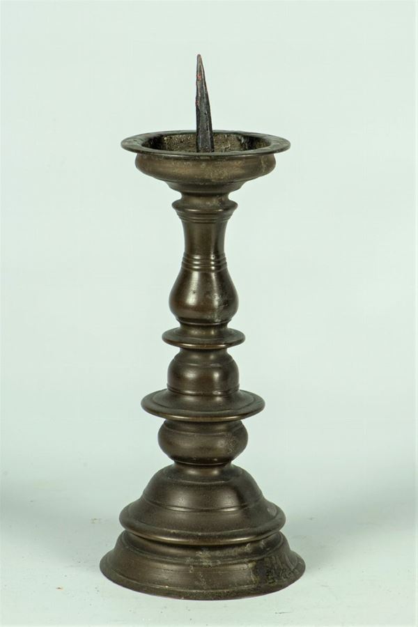 Turned patinated bronze torch