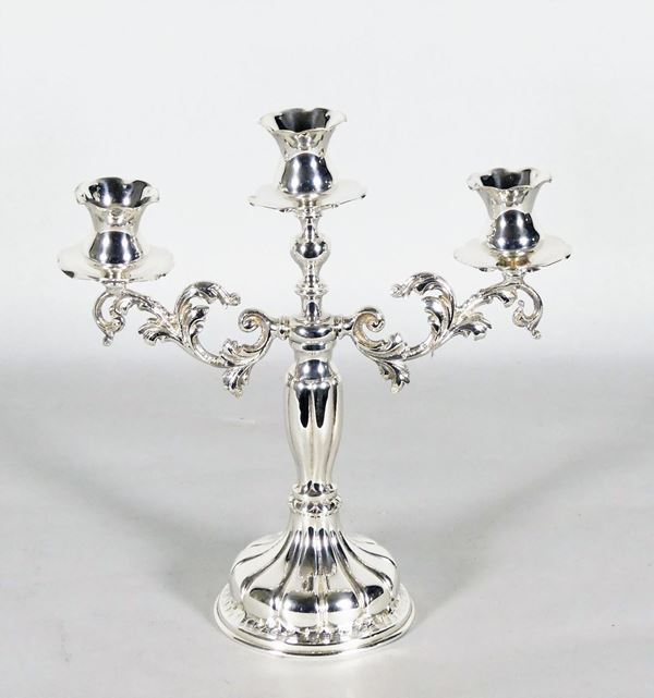 Candelabra in silvered and embossed metal with three flames