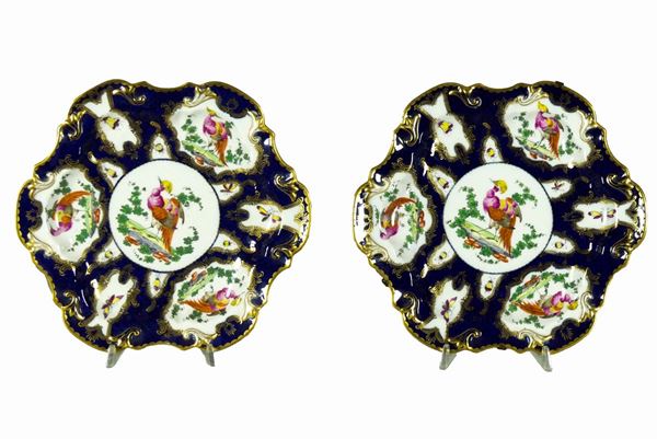 Pair of white and blue porcelain wall plates with rounded arch shape