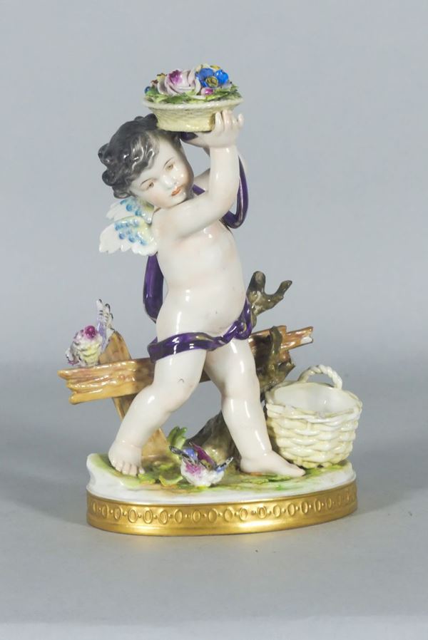 Statuina &quot;Putto con cesto di fiori&quot; in porcellana Capodimonte