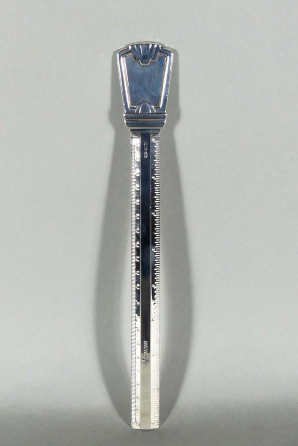 Silver letter opener in the shape of a ruler. 170 g