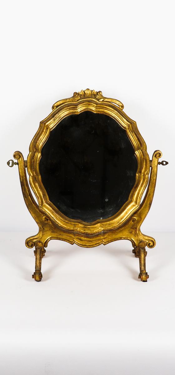Small dressing table in gilded and carved wood