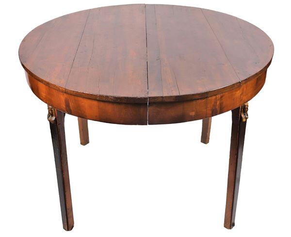 Empire Tuscan dining table in walnut with round shape extendable