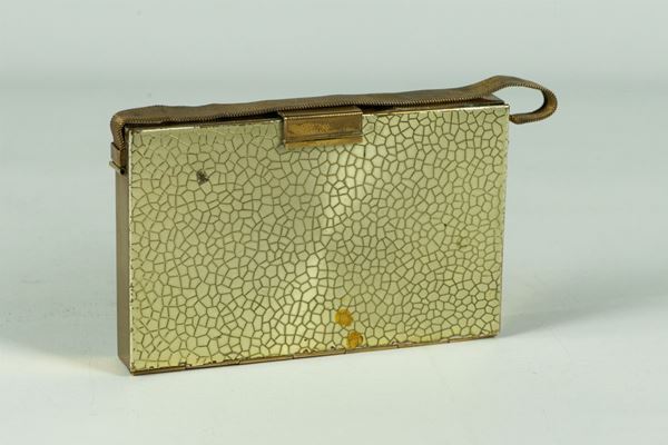 Trousse in metallo dorato
