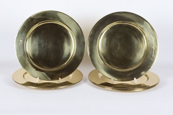 Lot of seven plates in gilded metal