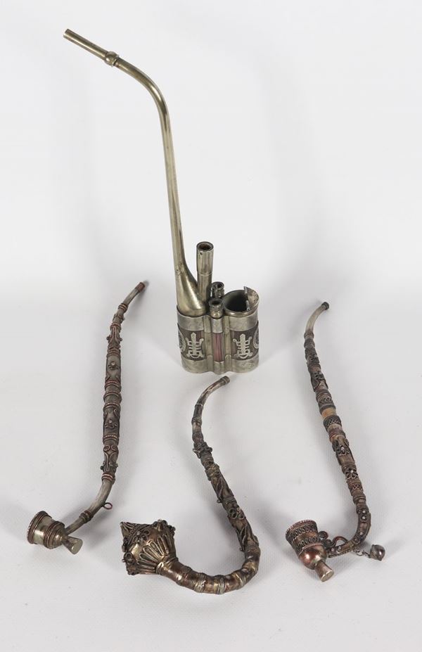 Four ancient Chinese and oriental pipes