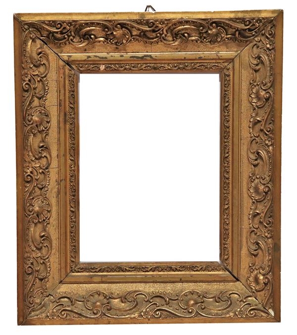 Antique small French frame in gilded and carved wood