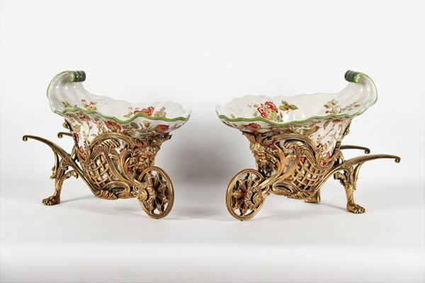 Pair of wheelbarrow planters in porcelain and gilt bronze