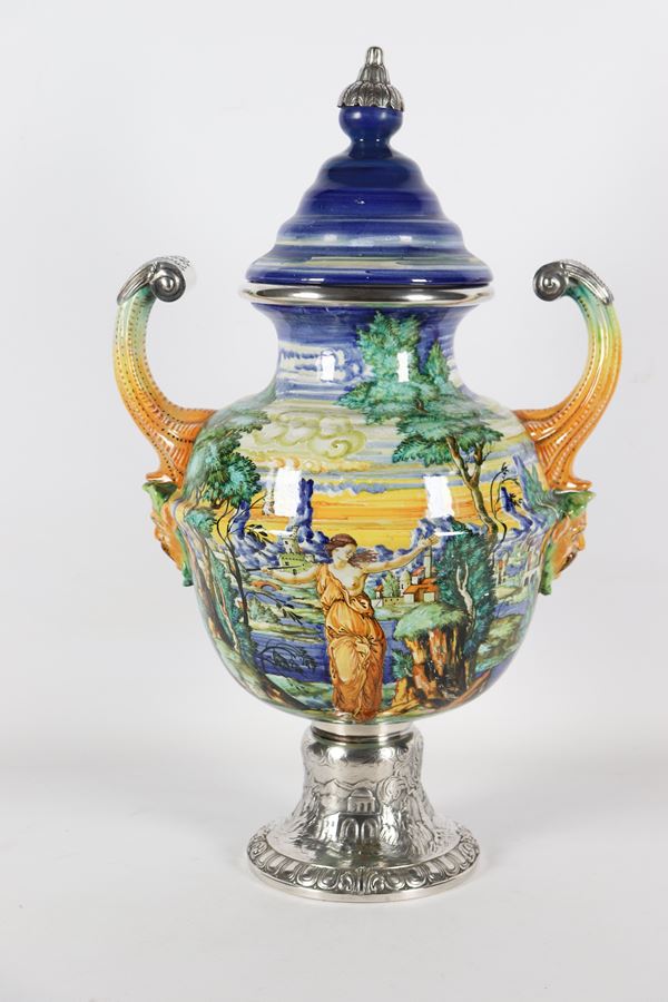 Two-handled vase in glazed majolica from Pesaro, marked Mengaroni, with base and profiles in silver