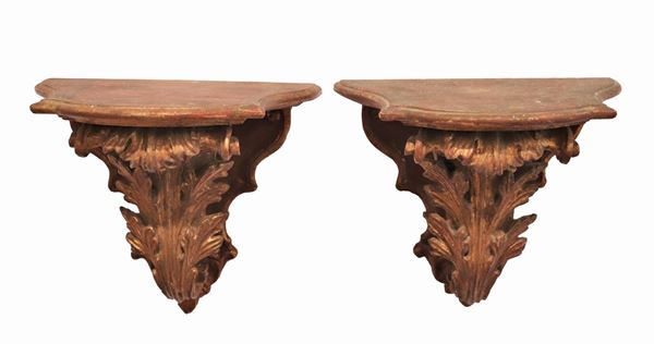 Pair of small wall shelves in gilded wood