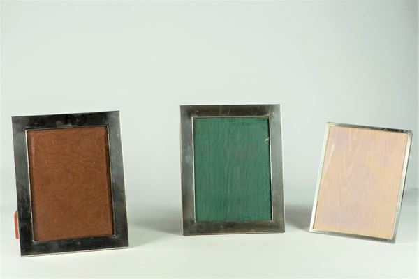 Three silver photo frames