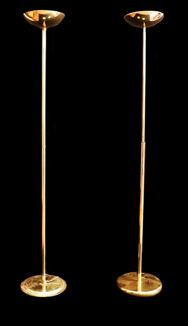 Two floor lamps in gilded brass