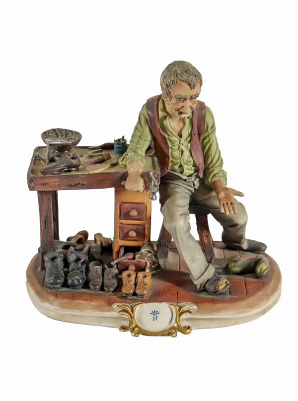 "Cobbler" group in polychrome Capodimonte ceramic