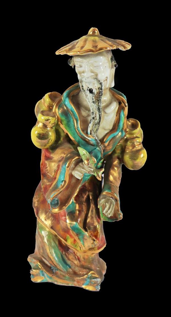 Chinese figurine "Old man with water bottles" in enamelled and polychrome stoneware