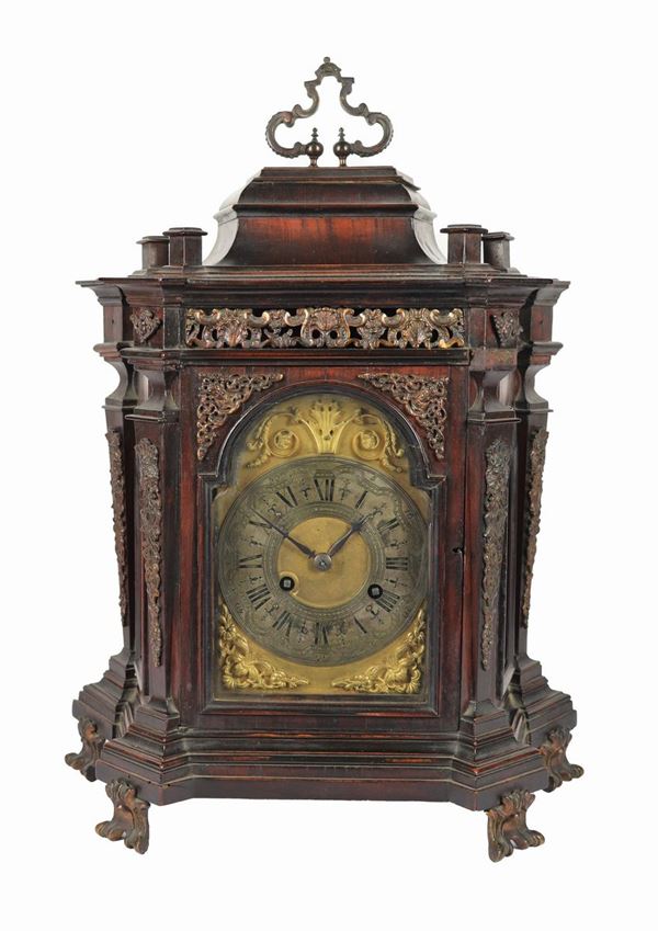 Antique table clock in the shape of a walnut temple
