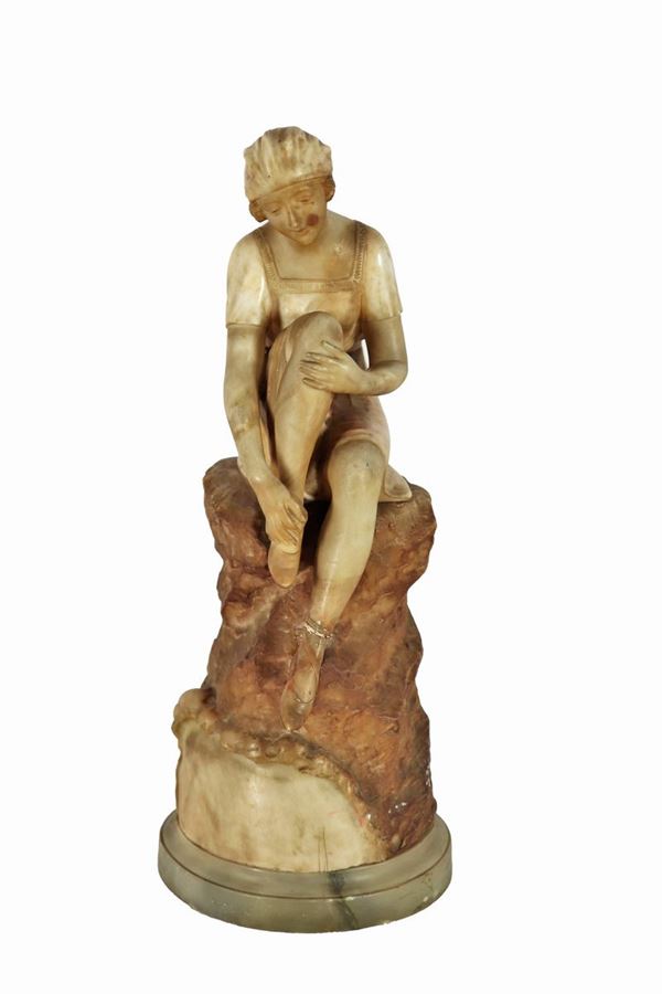 French Art Nouveau sculpture in alabaster marble "Girl sitting on a rock". Signed.