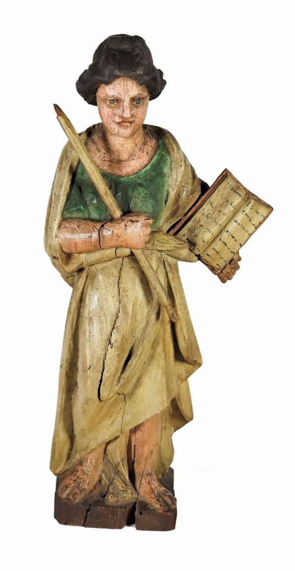 Ancient sculpture "Santa with missal and candle" in polychrome wood