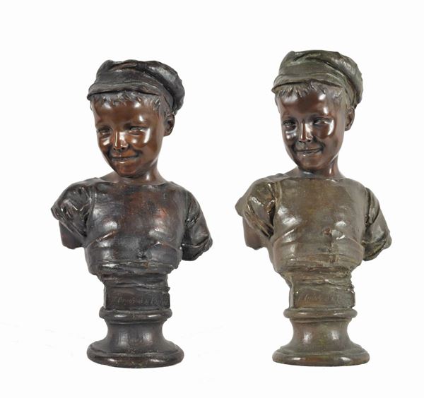Pair of antique bronze busts "Monelli". A bust is signed.
