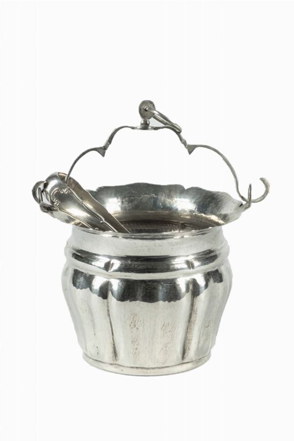 Ice bucket with hammered silver clamp