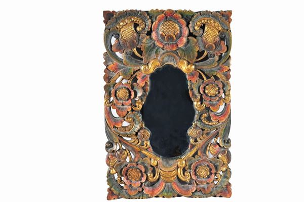 Small oval South American mirror in decorated and gilded wood