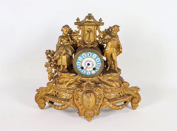 Table clock in gilded, chiseled and embossed metal with Sévres porcelain dial