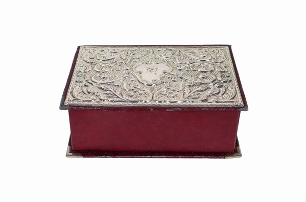 Rectangular book-shaped jewelry box, with lid covered in chiseled and embossed silver
