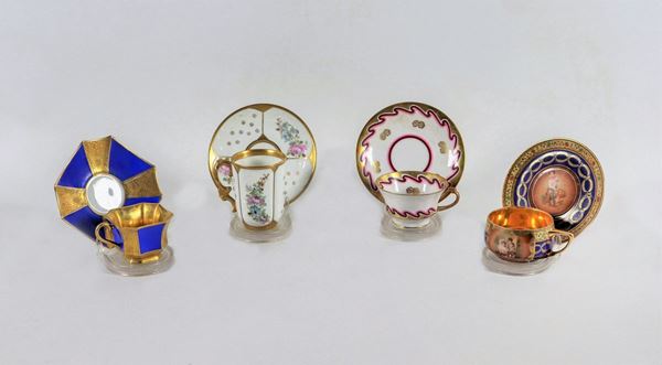 Lotto di quattro tazzine con piattini in porcellana policroma Ginori, Rosenthal, Boemia e Limoges