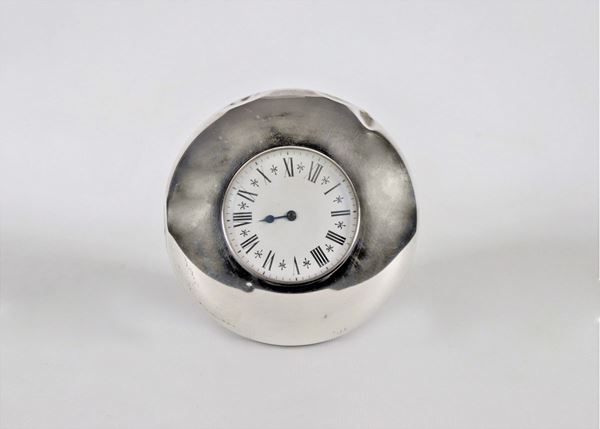 "Ox Eye" table clock coated in silver with white dial and Roman numerals