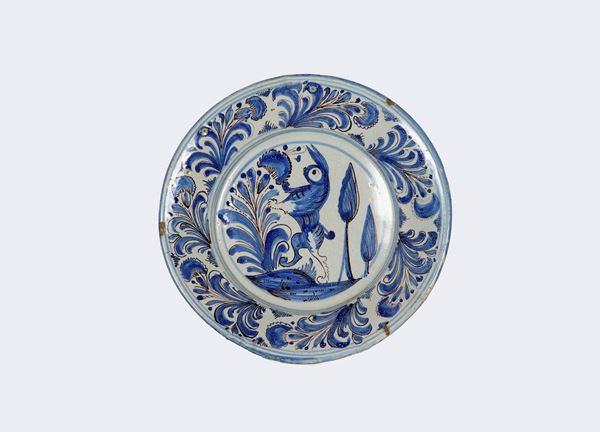 Laterza glazed majolica wall plate with blue decorations and rabbit with leaves in the center