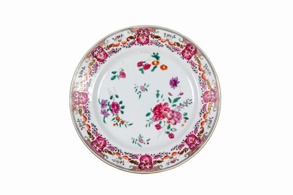 "Compagnia delle Indie" wall plate in majolica with embossed enamel decorations with flower motifs